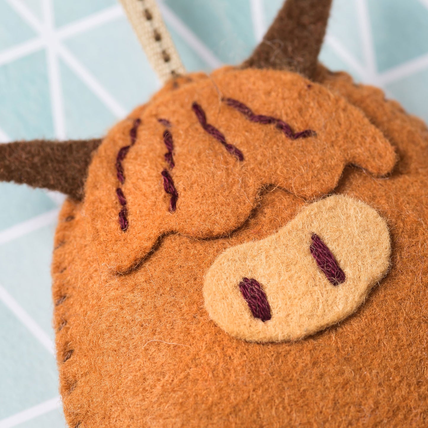 Folk embroidered highland cow